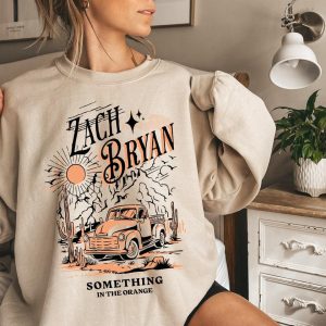 Zach Bryan Something In The Orange Vintage Sweatshirt – Apparel, Mug, Home Decor – Perfect Gift For Everyone