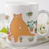 Cute Chubby Orange Cat Having Hot Coffee Tea In Garden Simple White Mug